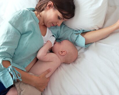Mother breastfeeding her baby, highlighting the benefits for both mother and child